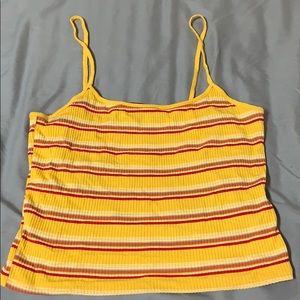 Yellow cropped tank.